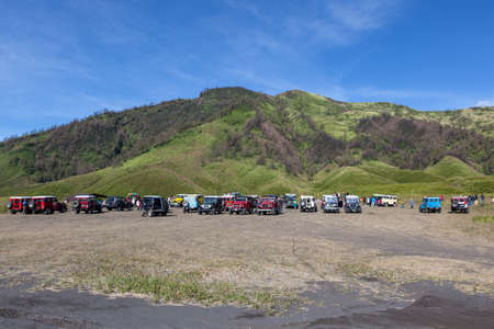 Bromo-Tengger-Semeru NP, JAVA/INDONESIA - April 17, 2015: Tourist jeeps in savanna of Tengger caldera near Bromo volcano at Java island in Indonesia.のeditorial素材