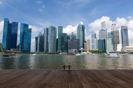SINGAPORE - Mar 26, 2015: Singapore downtown across marina bay from jetty in daylight.のeditorial素材