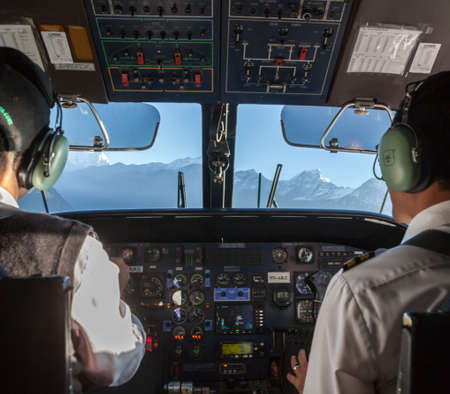 KATHMANDU/NEPAL - OCTOBER 18, 2015: Airplane cockpit of a small airplane flying from Kathmandu to...