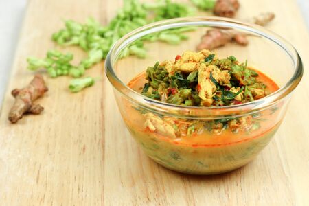 Red chicken curry with cowslip creeper and melientha suavisの写真素材