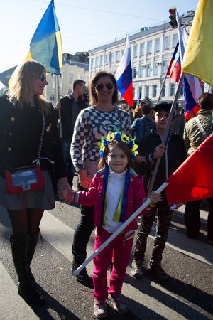 Moscow, Russia - September 21, 2014. The little girl in the Ukrainian wreath Peace March in Moscow against war with Ukraineのeditorial素材