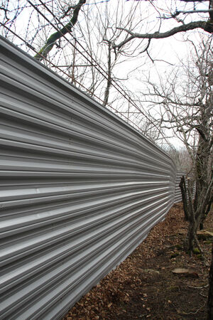 Krasnodar region, Russia - March 23, 2012. Fence villas Governor Tkachev in the protected forest with trees, listed in the Red bookのeditorial素材