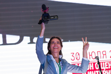 Moscow, Russia - September 20, 2015. Unknown journalist with a video camera. A Russian opposition rally for democracy. Moscow city area Marinoのeditorial素材