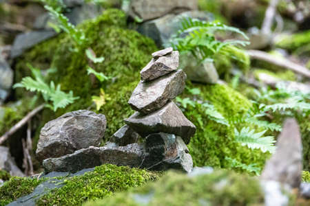 A stack of stones stands on top of each other. Mysterious ritualの写真素材