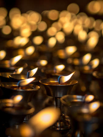 Burning candles in a Temple, Muktinath, Nepal