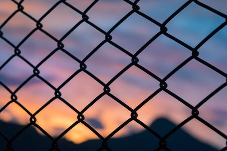 Sunset outside the cageの写真素材