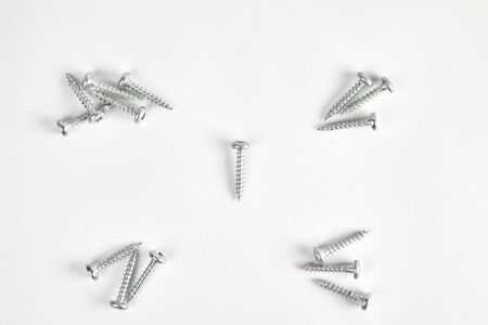 Top view of construction screws isolated on a white background.の写真素材