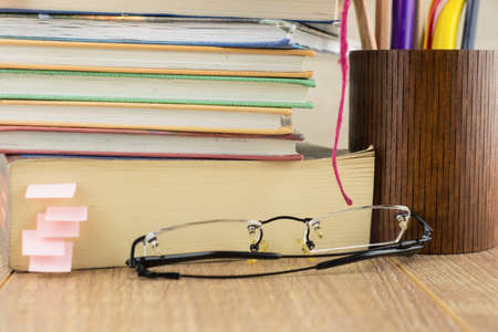 book Notepad pencils and glassesの写真素材