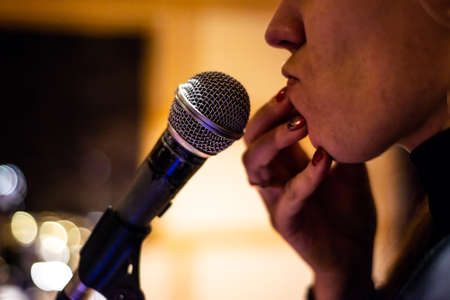musical instruments: part of a man's face close up in front of a microphoneの写真素材