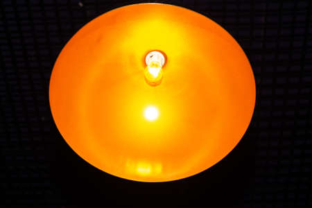light bulb in the middle of the yellow circleの写真素材