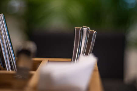 cutlery in a wooden standの写真素材