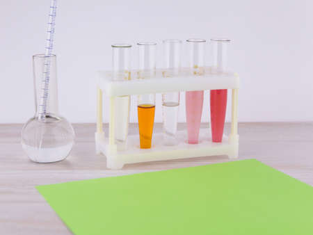 Statement of expert opinion: a Number of tubes with multi-colored contents and a flask with a...