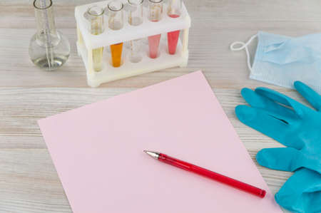 record diagnosis, medical report: the pink sheet of blank paper and red pen on it, around in...