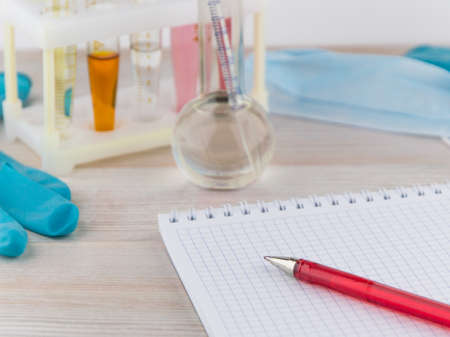 chemical analysis: ball pen in short focus on the tip lying on the Notepad on the background of the...