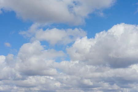 clear plain blue sky with white cloud with space for text background. Sky background with tiny...