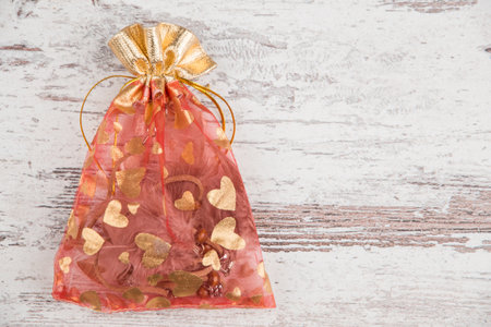 gift bag with hearts on white old Boardの写真素材