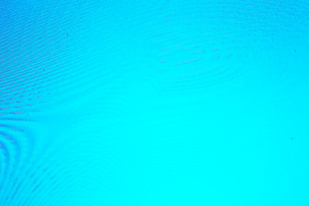An abstract background with clear azure waves, interference, moire