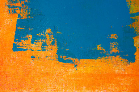 creative background, a spot of colored primer rubbed on the surface of a linen canvas, temporary...