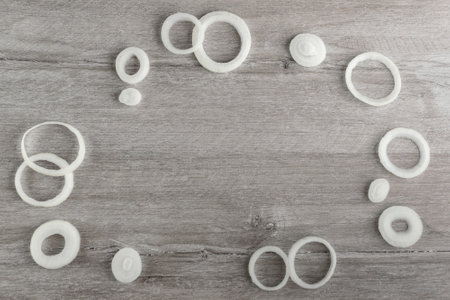 Background composition: onion rings are located at the edge of the frameの写真素材
