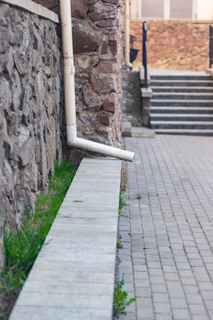 drainpipe next to the stairs