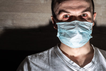 sick man in a medical mask, protection against viruses and bacteriaの写真素材