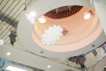 carved white snowflake suspended from the ceilingの写真素材