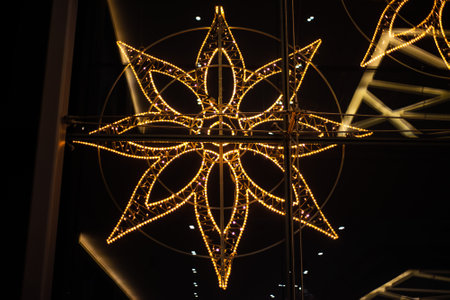 luminous large golden snowflake, home decorationの写真素材