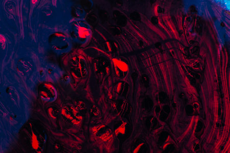 Abstract background of acrylic paint in red and blue tones. Fragment of artworkの写真素材
