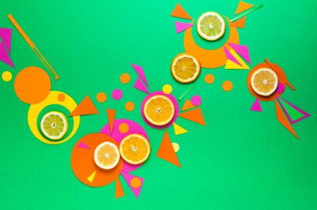 Suprematic colorful geometric shapes background with citrus fruits. Color blocking food and simple forms flat lay concept.の写真素材