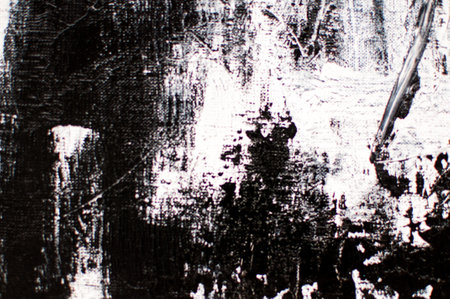 artistic black background with white chaotic paint spotsの写真素材