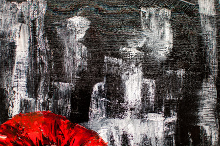 artistic black background with white and red paint blotsの写真素材