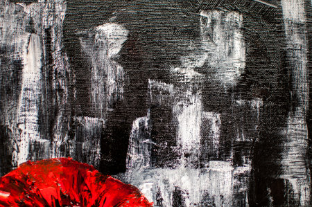 artistic black background with white and red paint blotsの写真素材