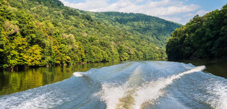 Photograph of the Cheat River from the back of a speed boat in West Virginia