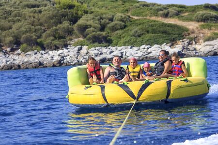 Family ride on the seaの写真素材