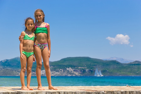 Girls on the wooden pierの写真素材