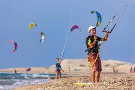 LEFKADA, GREECE - JULY 26, 2016: Unidentified man kite-surfer at famous Milos beach in summer day on July, 26, 2017 in Lefkada, Greece.のeditorial素材