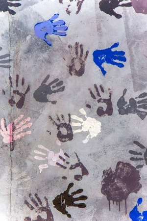 Colorful hands on the Berlin wall