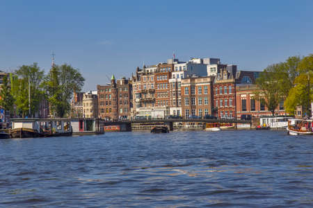 Ships on the river Amstel in Amsterdamのeditorial素材