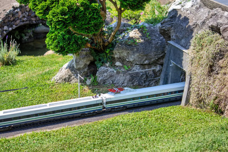 Miniature Train entering in the Stone Tunnelの写真素材