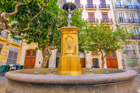 View of the small fountain in the center of Valenciaの写真素材