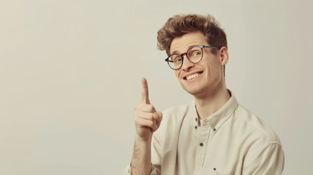 A cheerful person with glasses showing face expressions in the front of plain backgroundの素材