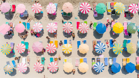Vibrant Beach with Umbrellas: A Colorful Aerial Perspectiveの素材