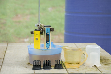 Measuring the pH of the water in hydroponic farm. Electronic pH meterの写真素材