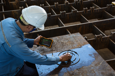 Ultrasonic test to detect imperfection or defect of steel plate in Workshop, NDT Inspection.の写真素材