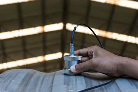 Ultrasonic test to detect imperfection or defect of wall thickness steel plate in Workshop, NDT Inspection.の写真素材