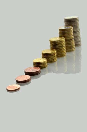 Isolated stairs of Euro coins with reflection.の写真素材