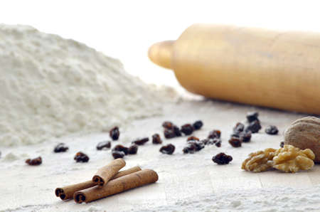 Prepared ingredients for making Christmas sweets  Rolling pin and flour in the background の写真素材