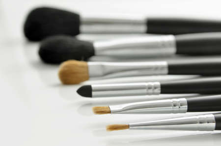 Professional makeup brushes lying on white background  Focus on one brush の写真素材
