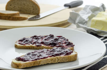 Breakfast with jam sandwiches, bread and butter 