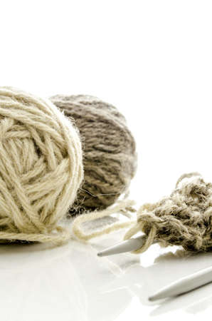 Grey ball of woolen thread and knitting needles  Isolated on a white background  の写真素材